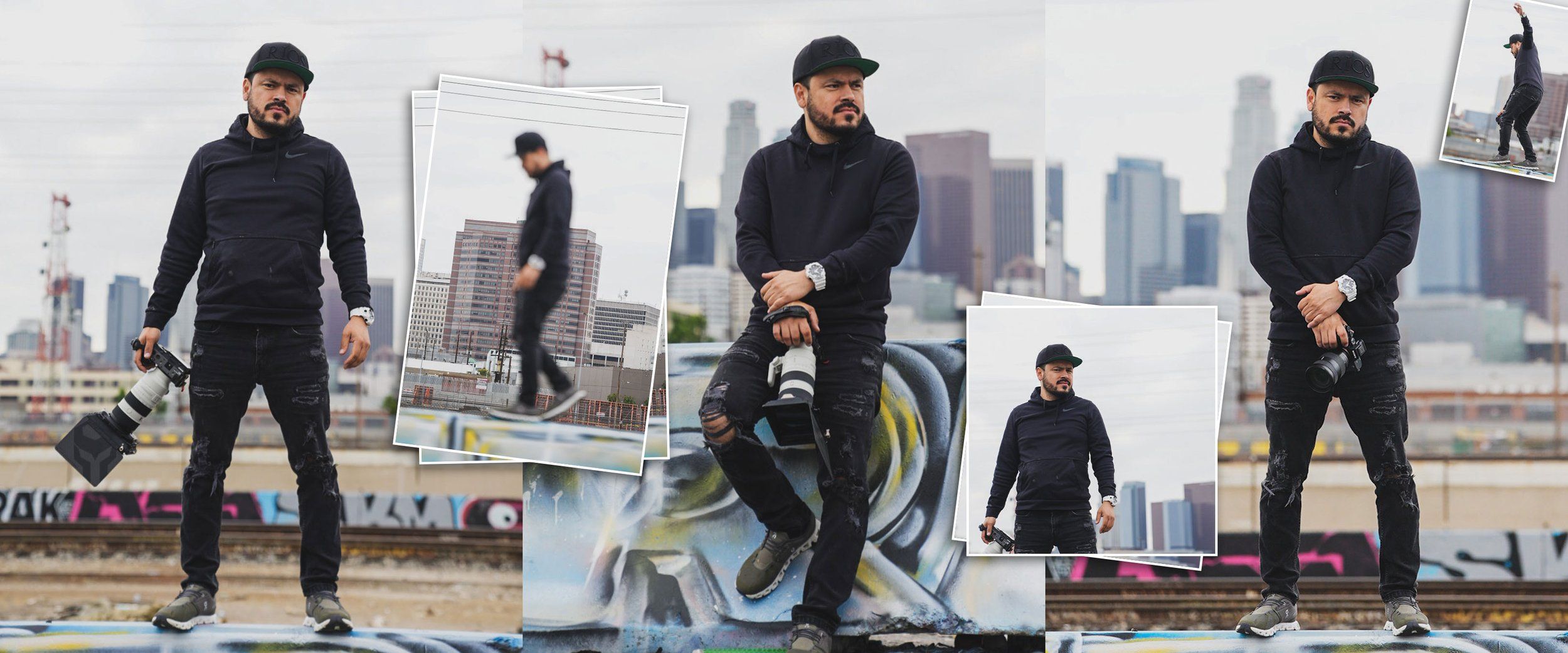 Group of dancers in black outfits perform choreographed moves against city skyline backdrop.