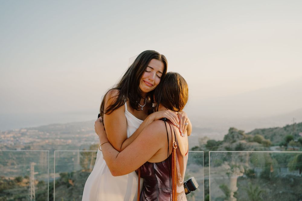 Bride getting emotional with her sister in Italy