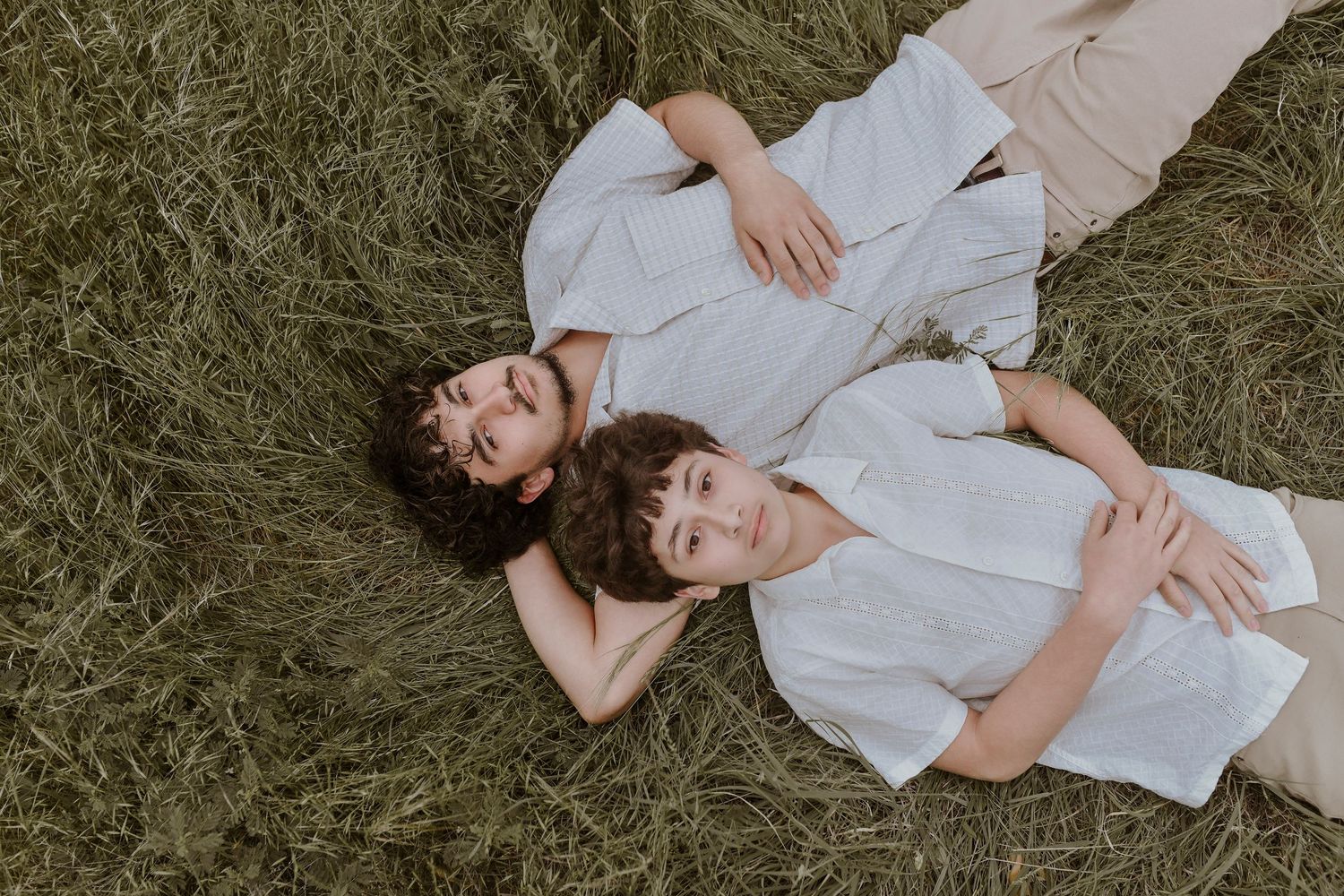 Candid sibling interaction during family portraits at Arbor Hills Nature Preserve
