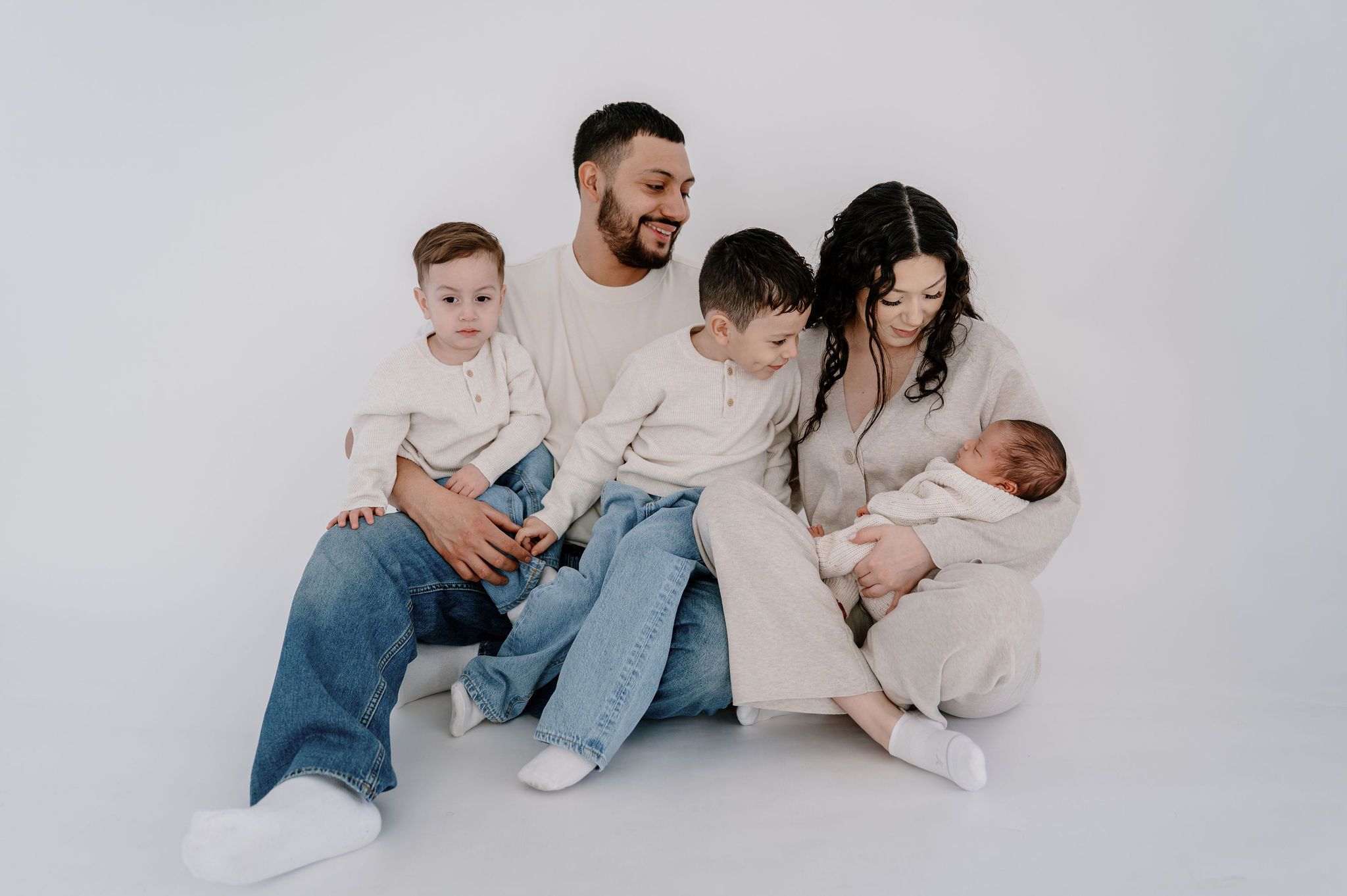 Lifestyle studio newborn photos at Casa Blanca, Tri-Cities with mom, dad, and little brothers