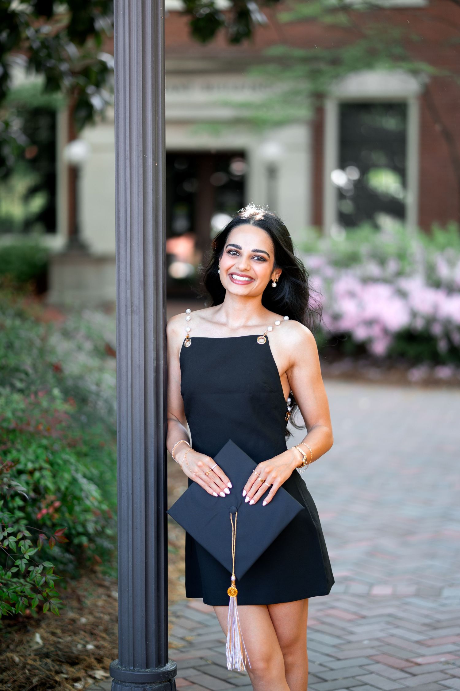 Smiling graduate poses for the best Atlanta grad photos at Georgia Tech with portraits by Pierre The Pear Photography