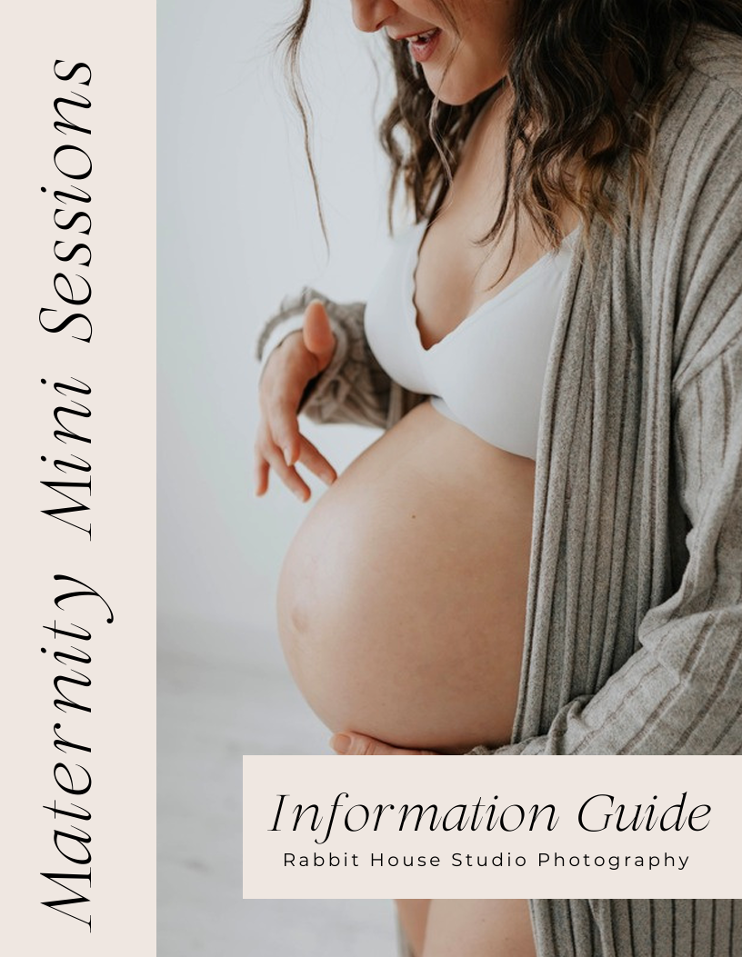 Pregnant woman in white bra and gray cardigan cradling baby bump for maternity mini sessions photography guide.