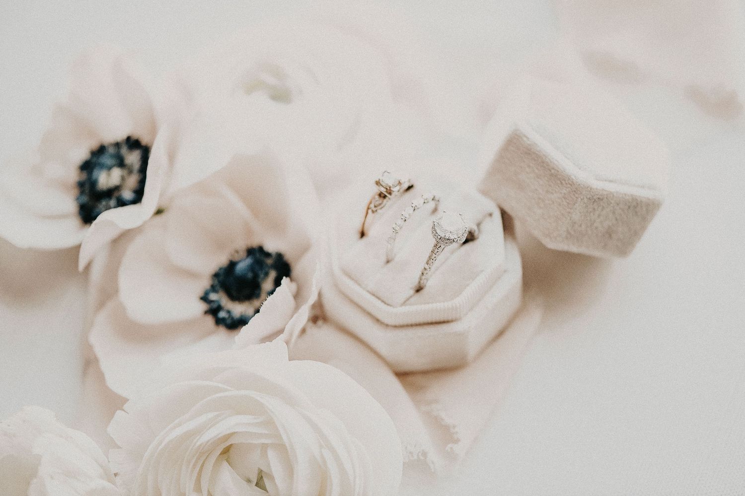 timeless bridal flat lay with lace, pearls, and ring box styled on neutral backdrop