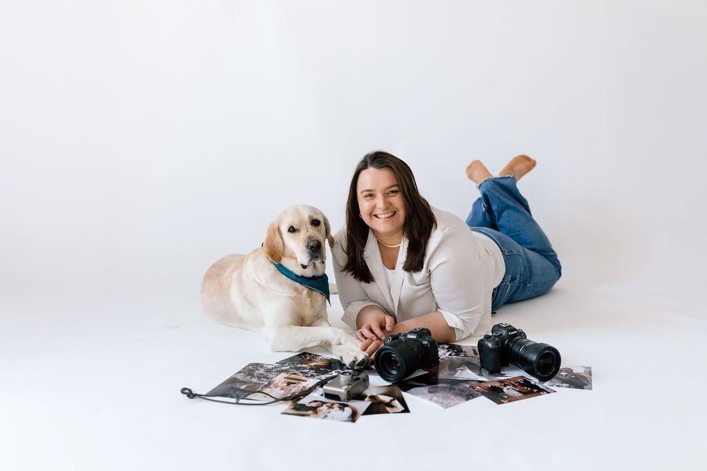Guelph pet photographer poses in meadow with her golden retriever