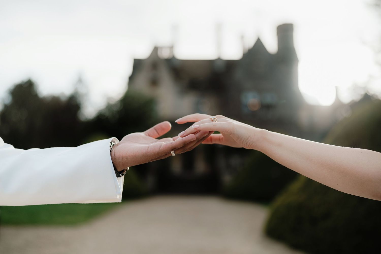 reaching hands during wedding at manor by the lake cheltenham
