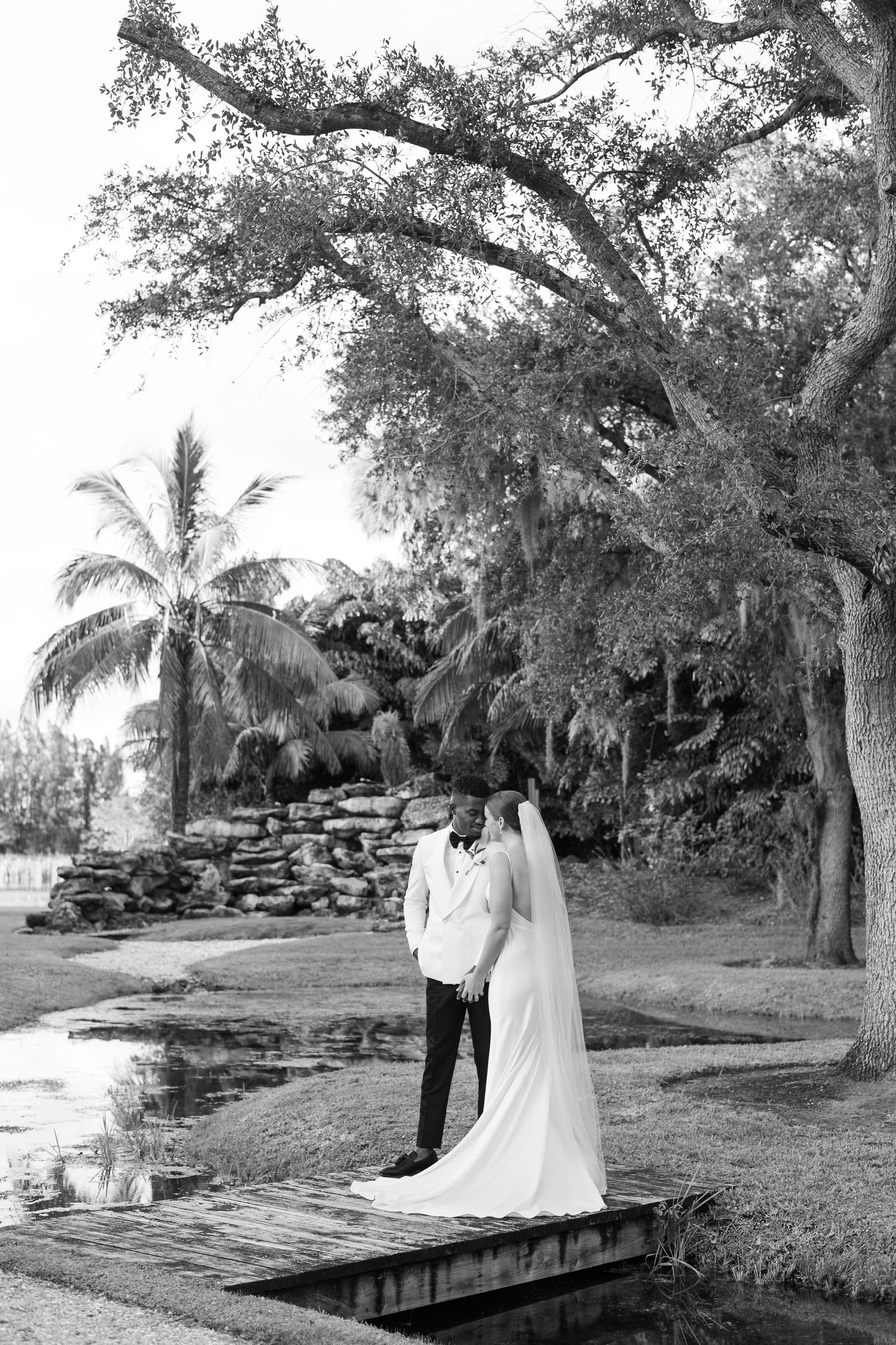 Golden Hour Bride & groom photos at wedding in Fort Pierce, FL at The Lake House venue captured by Lindsay McDow Photography. Vowd Weddings