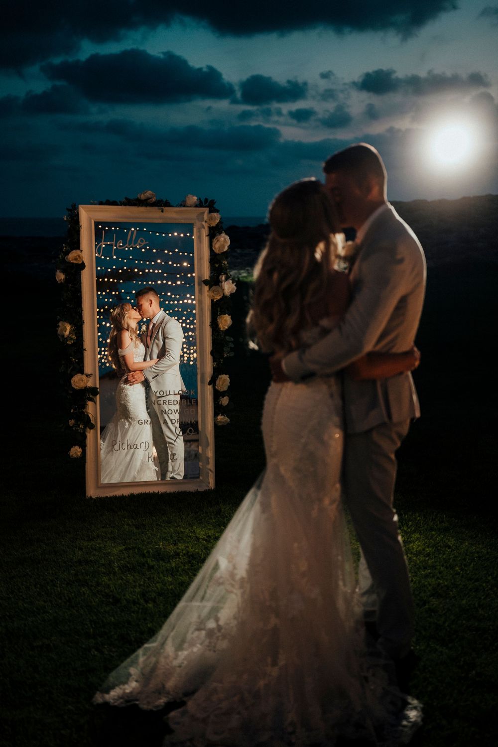 A romantic wedding photo series showing a couple dancing at night with a decorative frame and moonlit sky in the background.