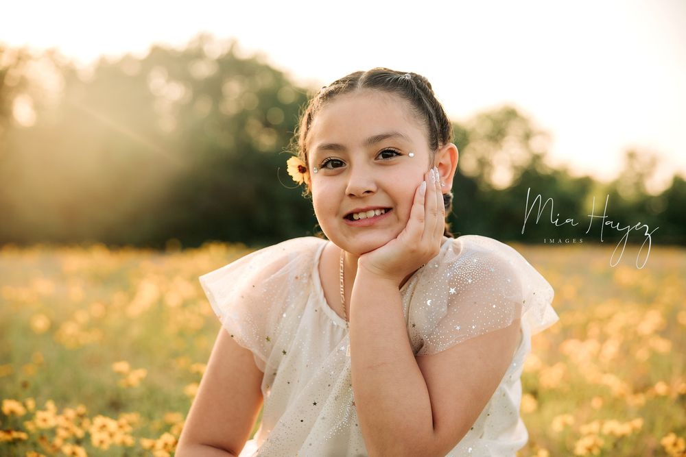 Candid lifestyle portraits showing playful expressions and laughter in natural outdoor setting.