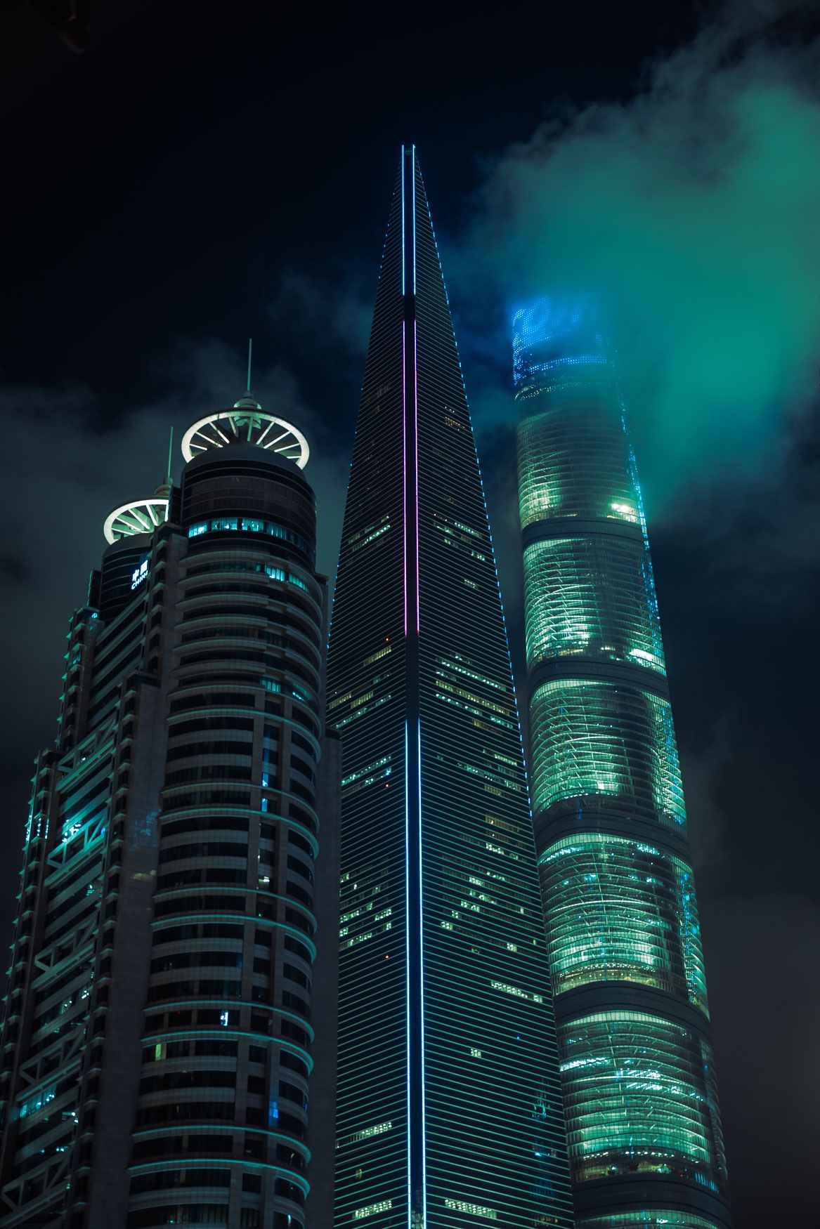Futuristic skyscrapers with neon green lighting pierce through dark clouds in a cyberpunk cityscape.