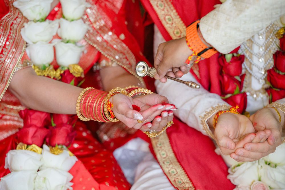 Hindu wedding ceremony taking place in the Cleveland area of Ohio indoors due to rain