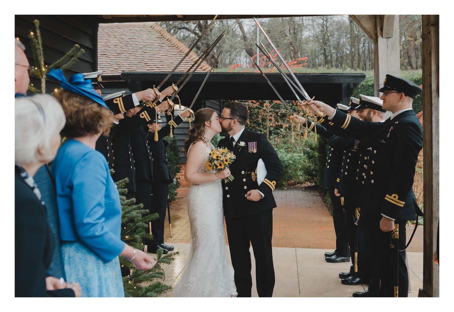 A romantic wedding moment captured in a series of six photos showing a couple sharing their first kiss in an elegant venue.