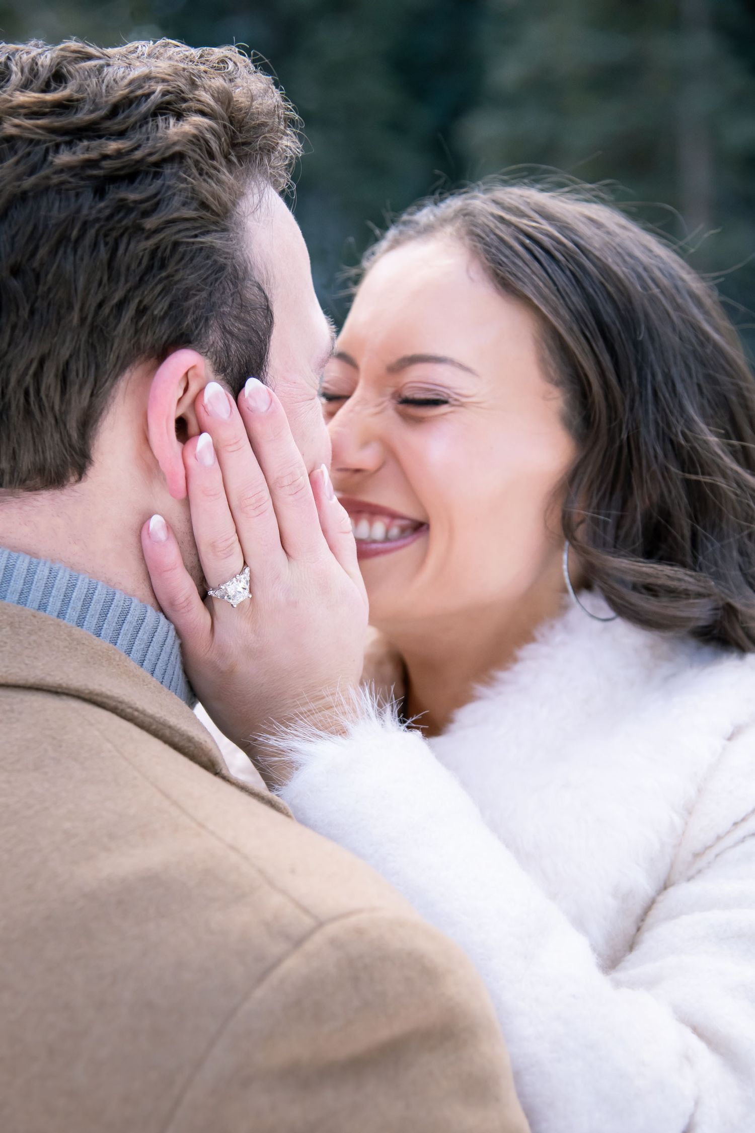 A fashionable couple shares an intimate moment together during Vail Colorado engagement photo session