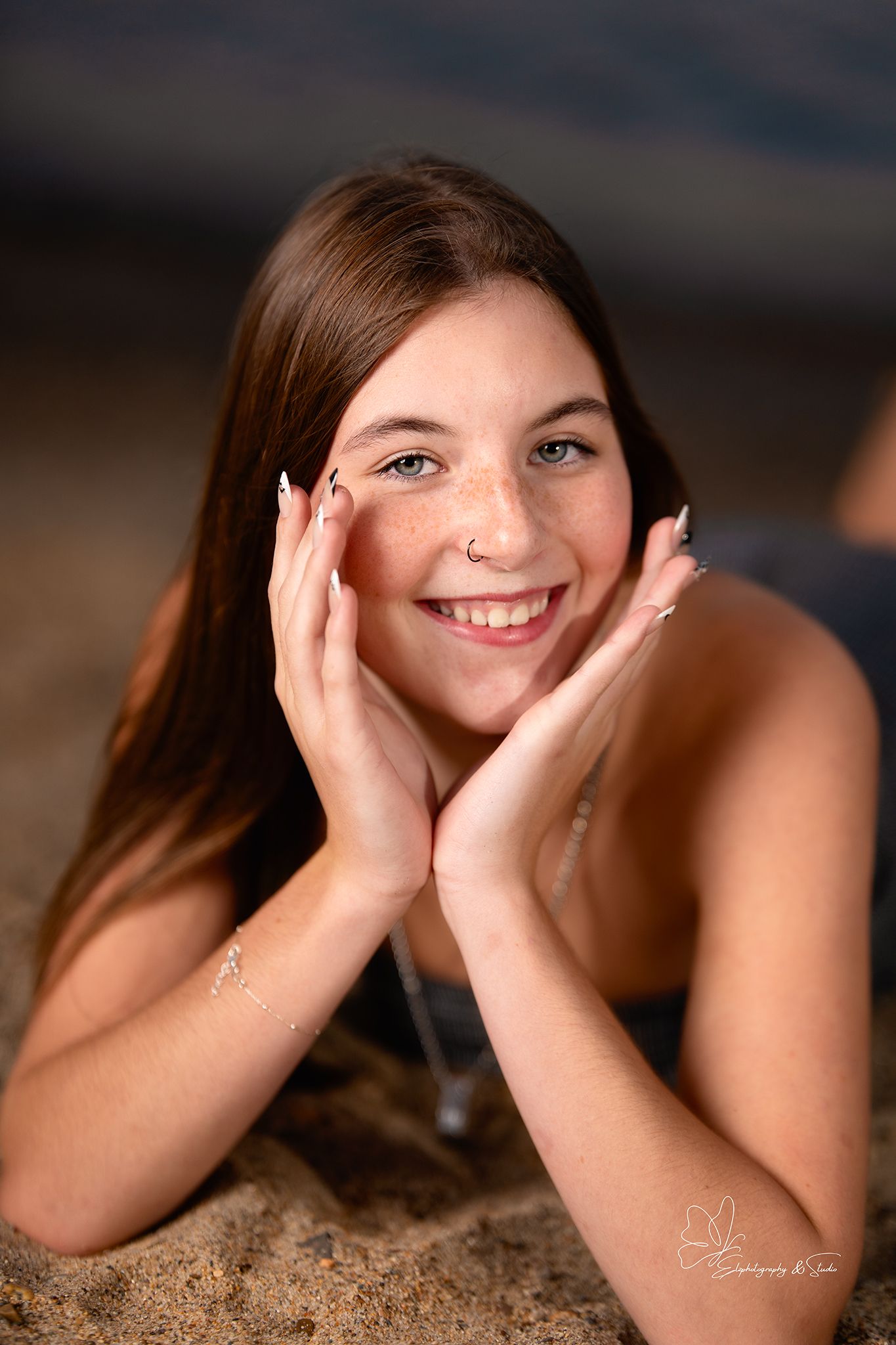 Close-up portrait series showing playful expressions against dark background in Pierre, South Dakota.
