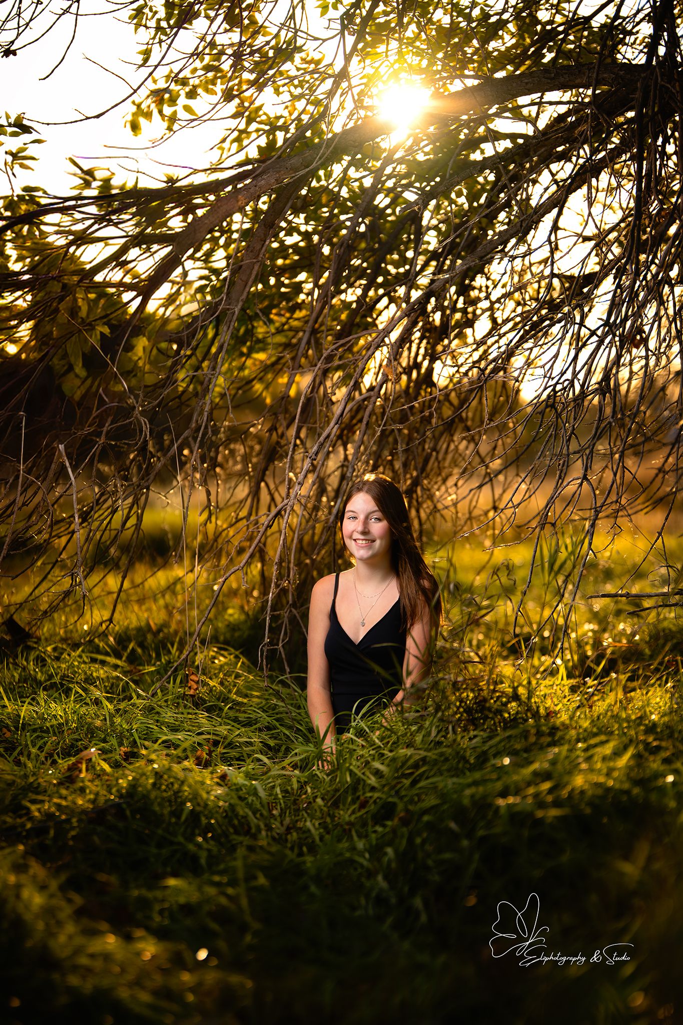 Artistic outdoor photo series with person sitting in grass during golden hour sunset in Pierre, South Dakota.