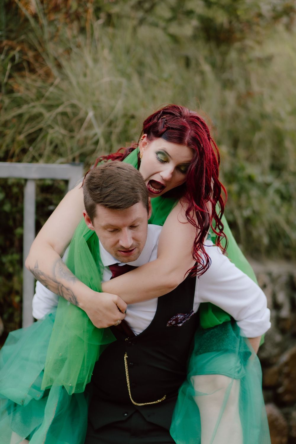 A playful sequence of romantic moments between a couple wearing green and white outfits in an outdoor setting.