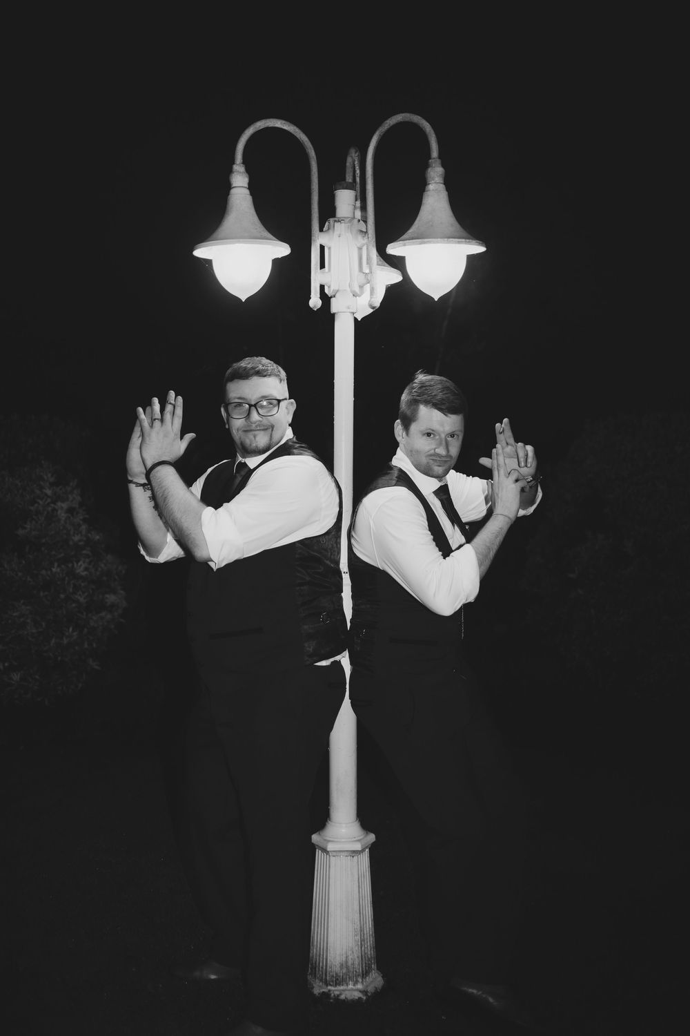 Black and white artistic photos show dancing figures in formal attire against dark backgrounds with dramatic lighting.
