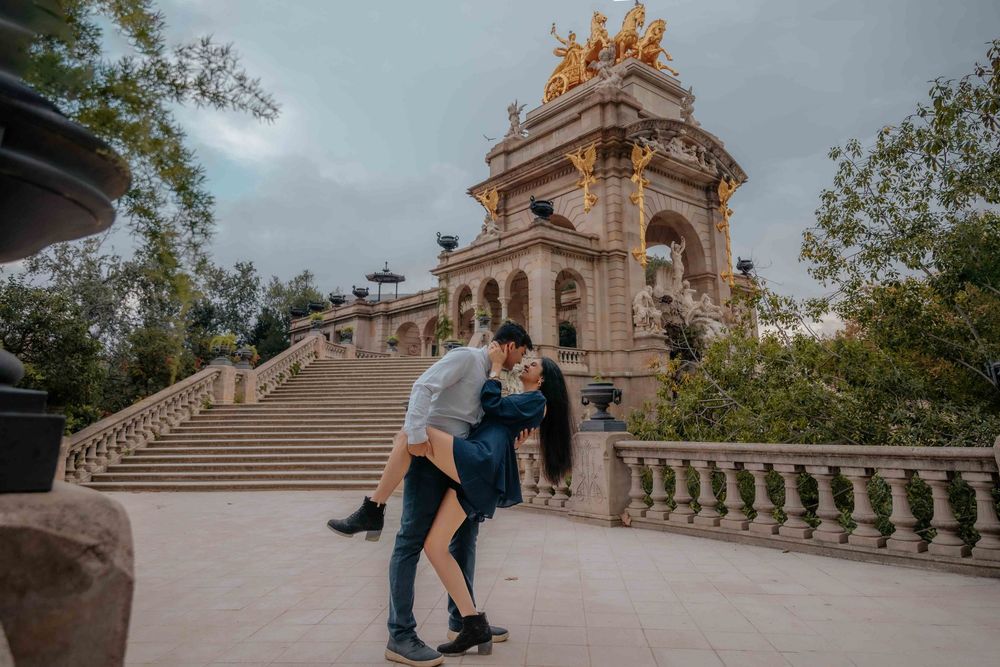 Aditya smiling at his wife during their Barcelona trip.
