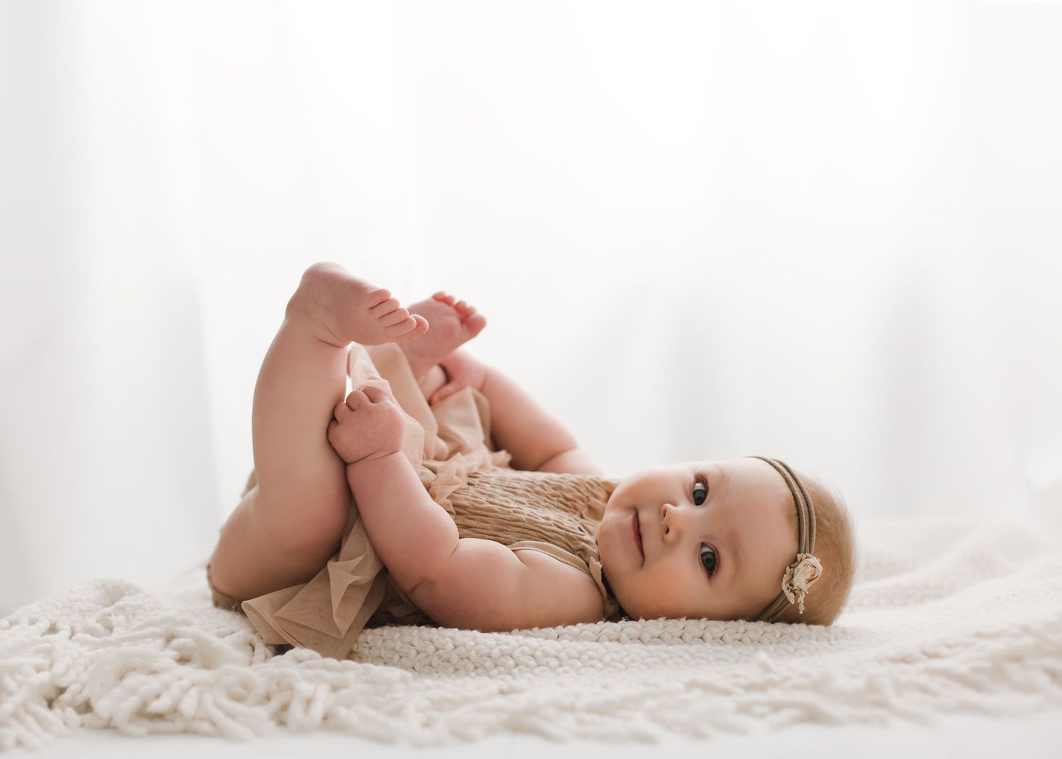 Studio sitter session baby portrait on white backdrop