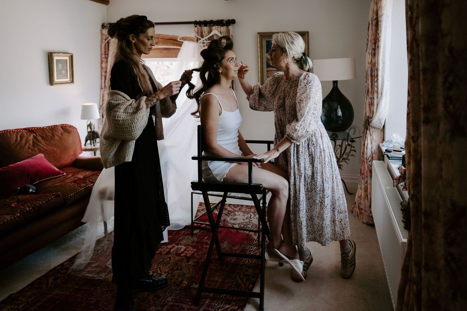 bride having hair and makeup done at dewsall court in herefordshire