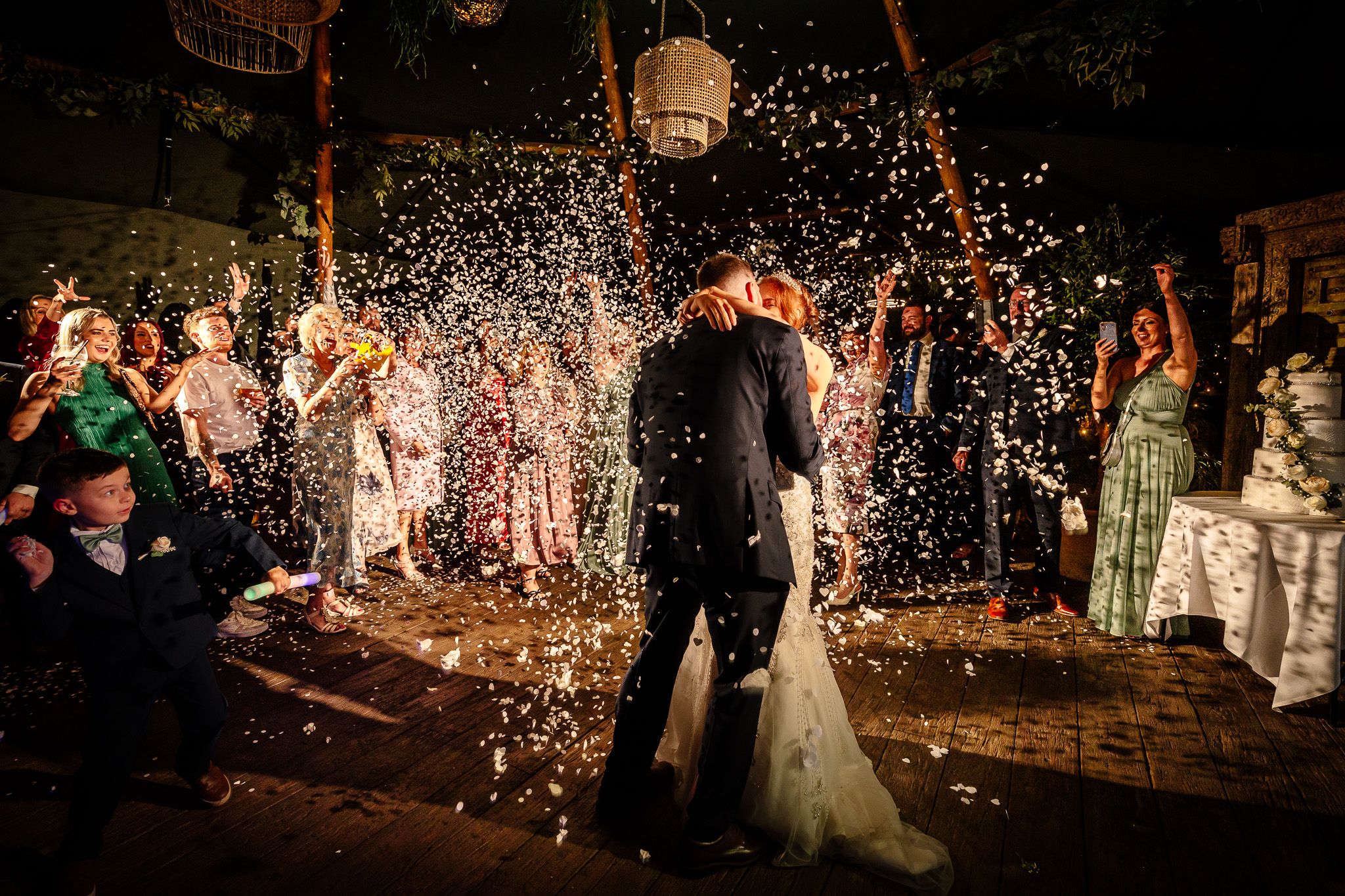 Wedding celebration with sparklers creating magical light trails in the darkness. Woodhill Hall.