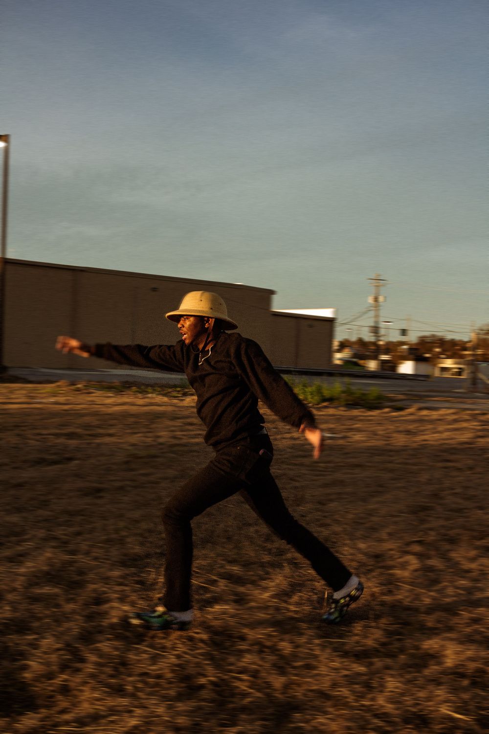 A sequence of four action shots showing someone stumbling and falling while running on rough terrain at dusk.