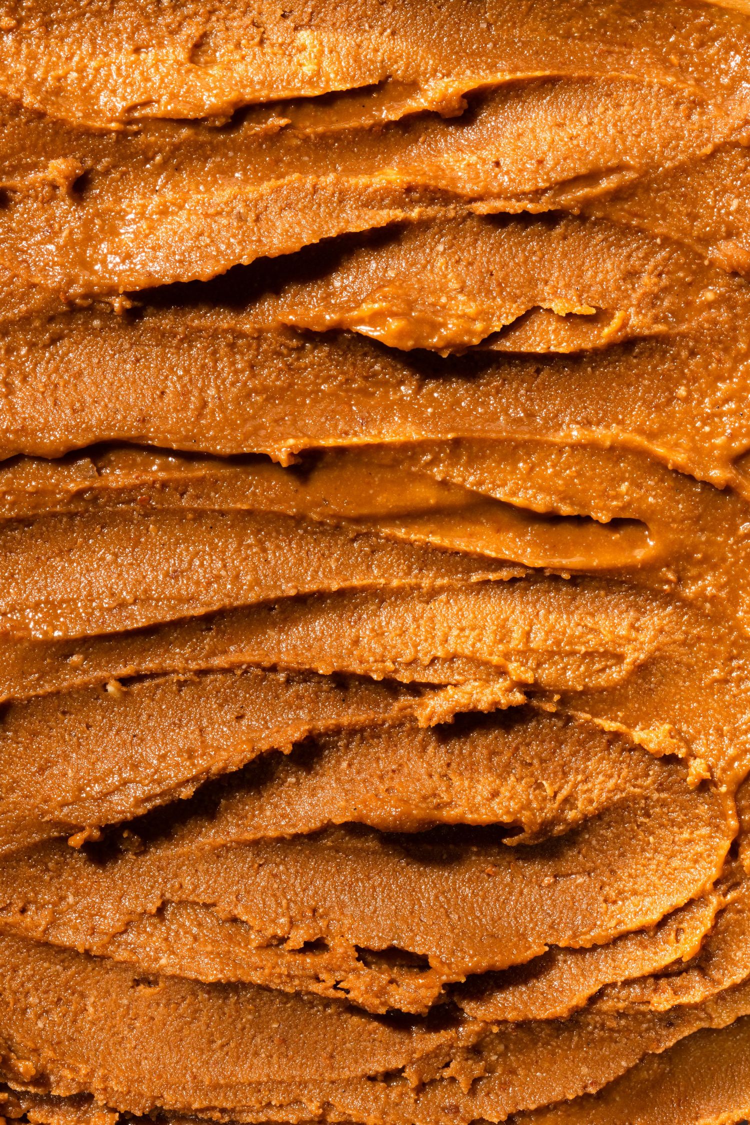 cashew butter texture macro, dramatic lighting