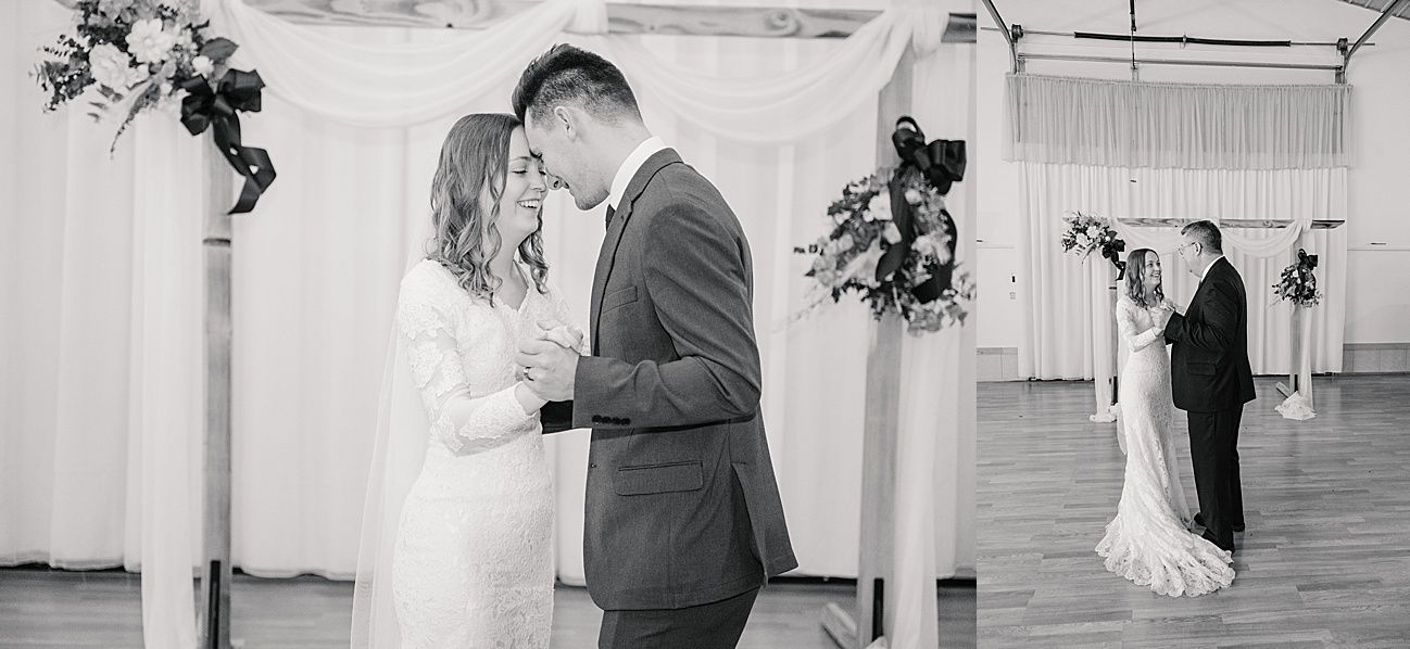 A romantic black and white wedding ceremony scene with couples embracing under floral arch decorations in an elegant venue.