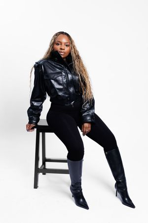 Model in black leather jacket and boots poses in multiple dynamic positions against white background.