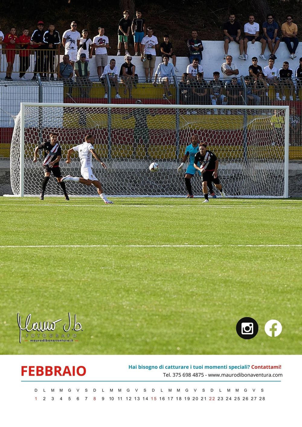 Soccer match action on a grass field with players and spectators visible in the background.