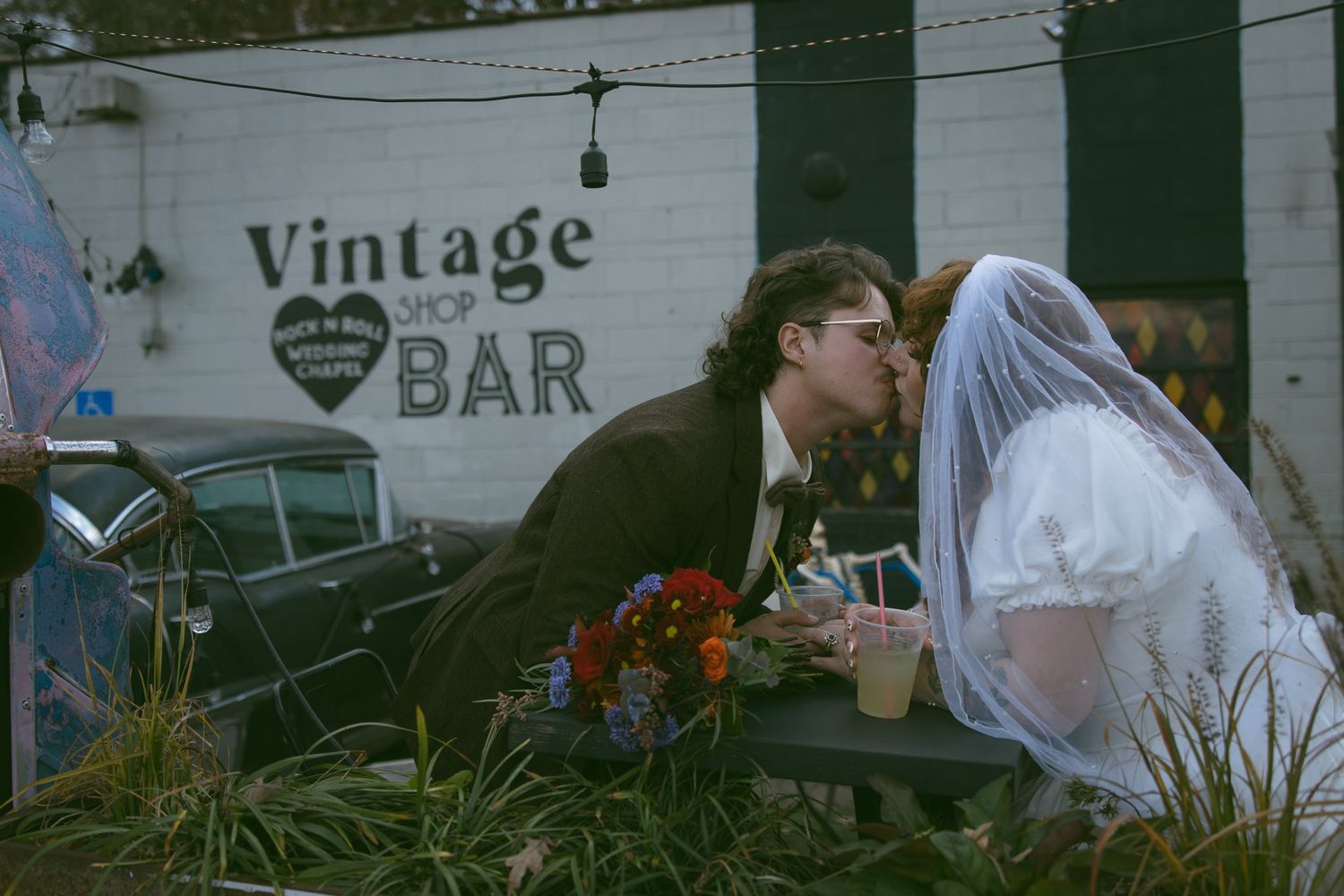 newlywed couple kissing at microwedding event in asheville fleetwoods wedding chapel