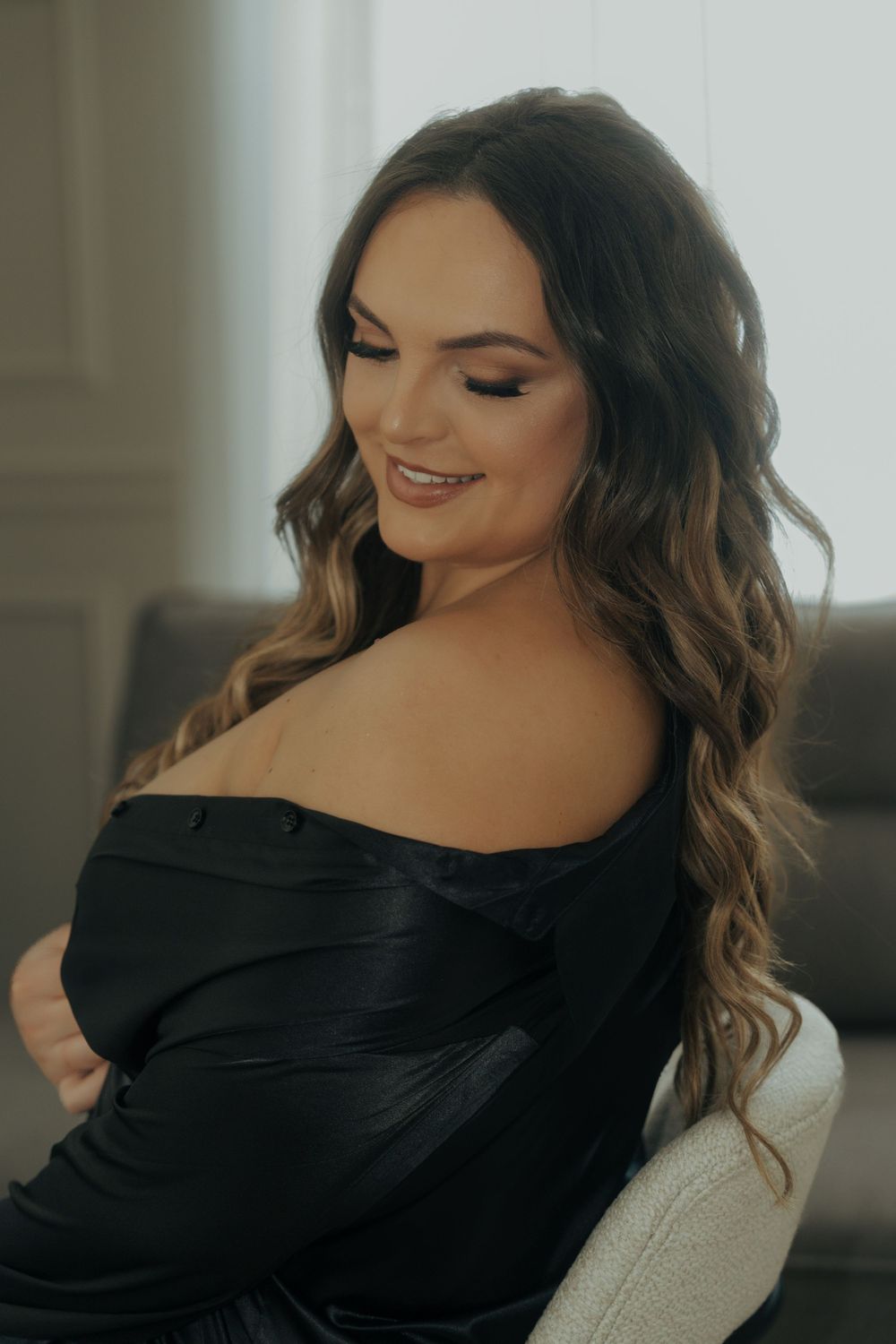 A series of glamour portraits showing a woman in a black off-shoulder top with wavy brown hair against a light background.