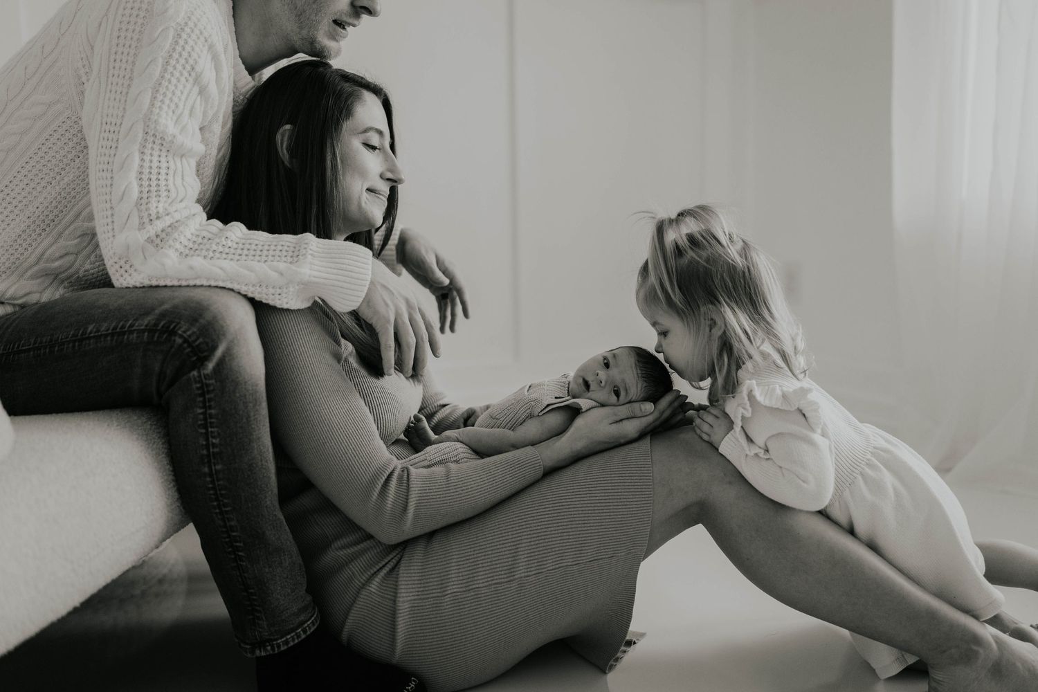 A series of black and white photos showing people lounging and relaxing on a couch in a casual setting.