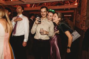 Group of friends taking a selfie at Henham Barns during reception