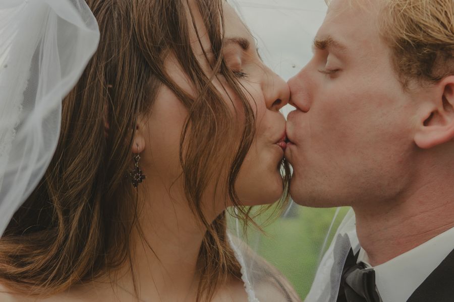 husband and wife kissing