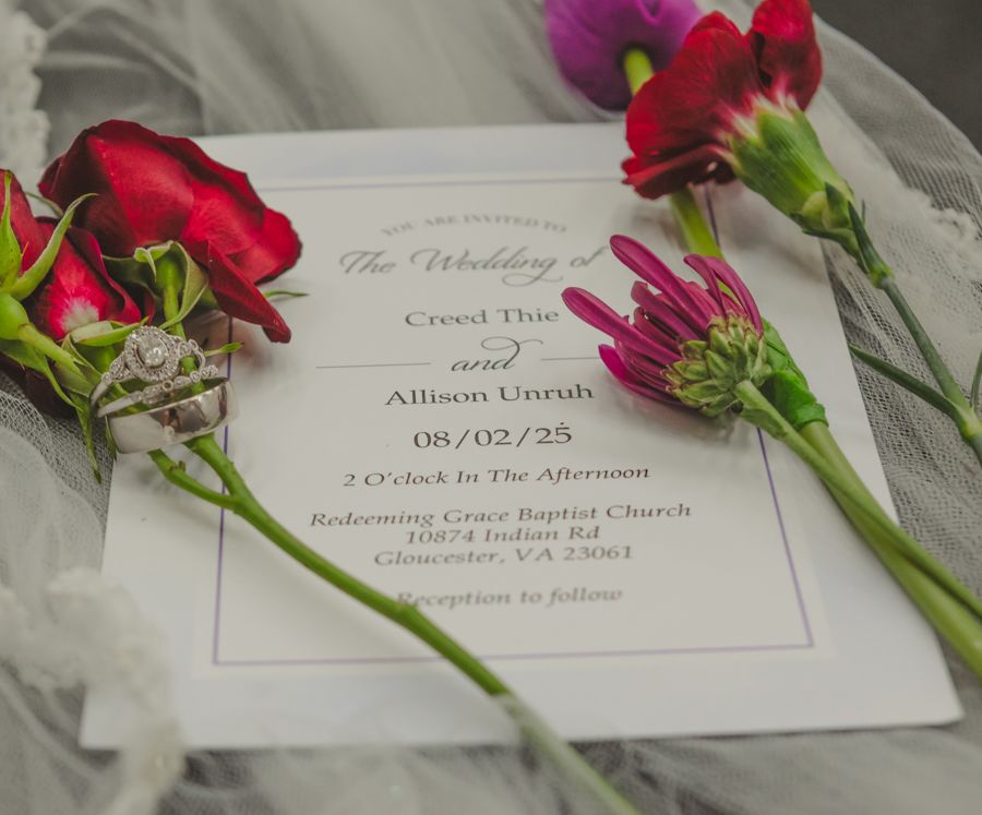 wedding invitation with flowers, wedding rings, vail