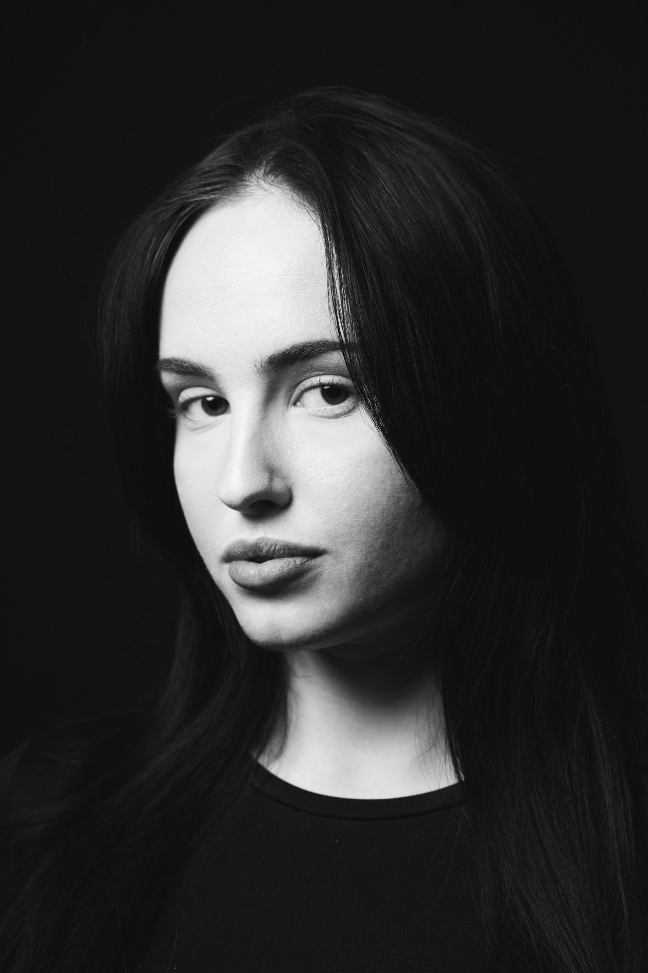 Fine art black and white studio portrait of a woman by Norfolk portrait photographer Valeria Makara-Howe