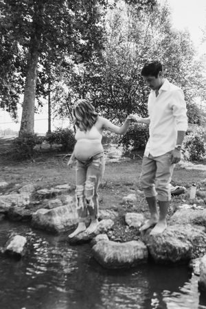 A series of vintage black and white photos showing someone jumping into a lake from rocks.