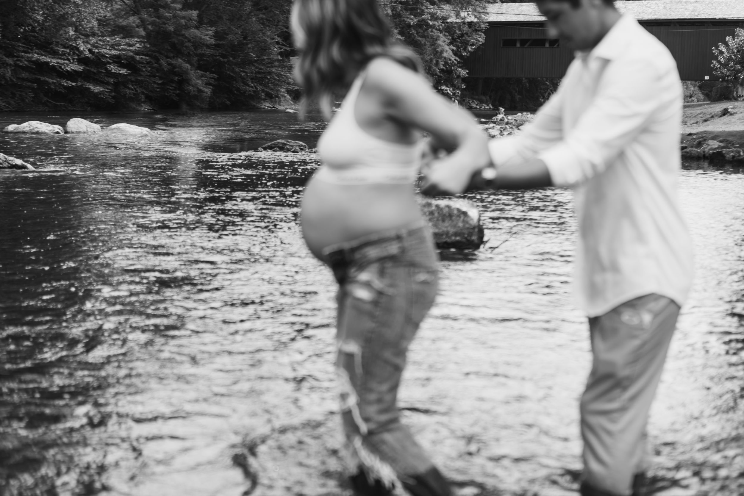 A black and white photo sequence shows someone fishing in a stream and reeling in their catch.