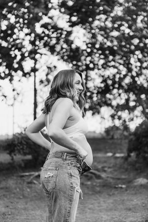 Black and white outdoor portrait series with natural bokeh background.