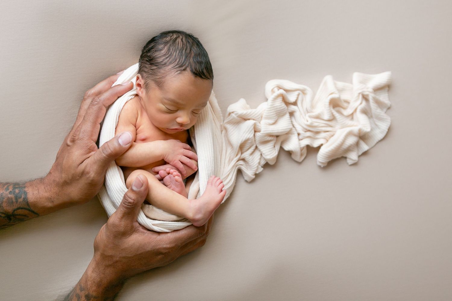 Easy newborn photography pose of baby sleeping, swaddled posed on his side. Orlando Newborn Photography, Sanford Newborn Photography