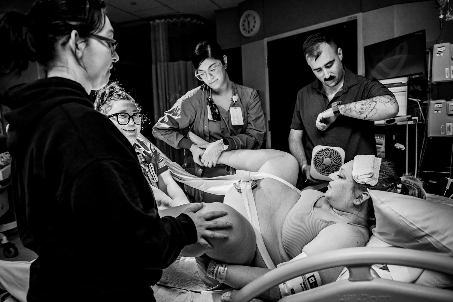 Laboring mother pushing in a hospital bed