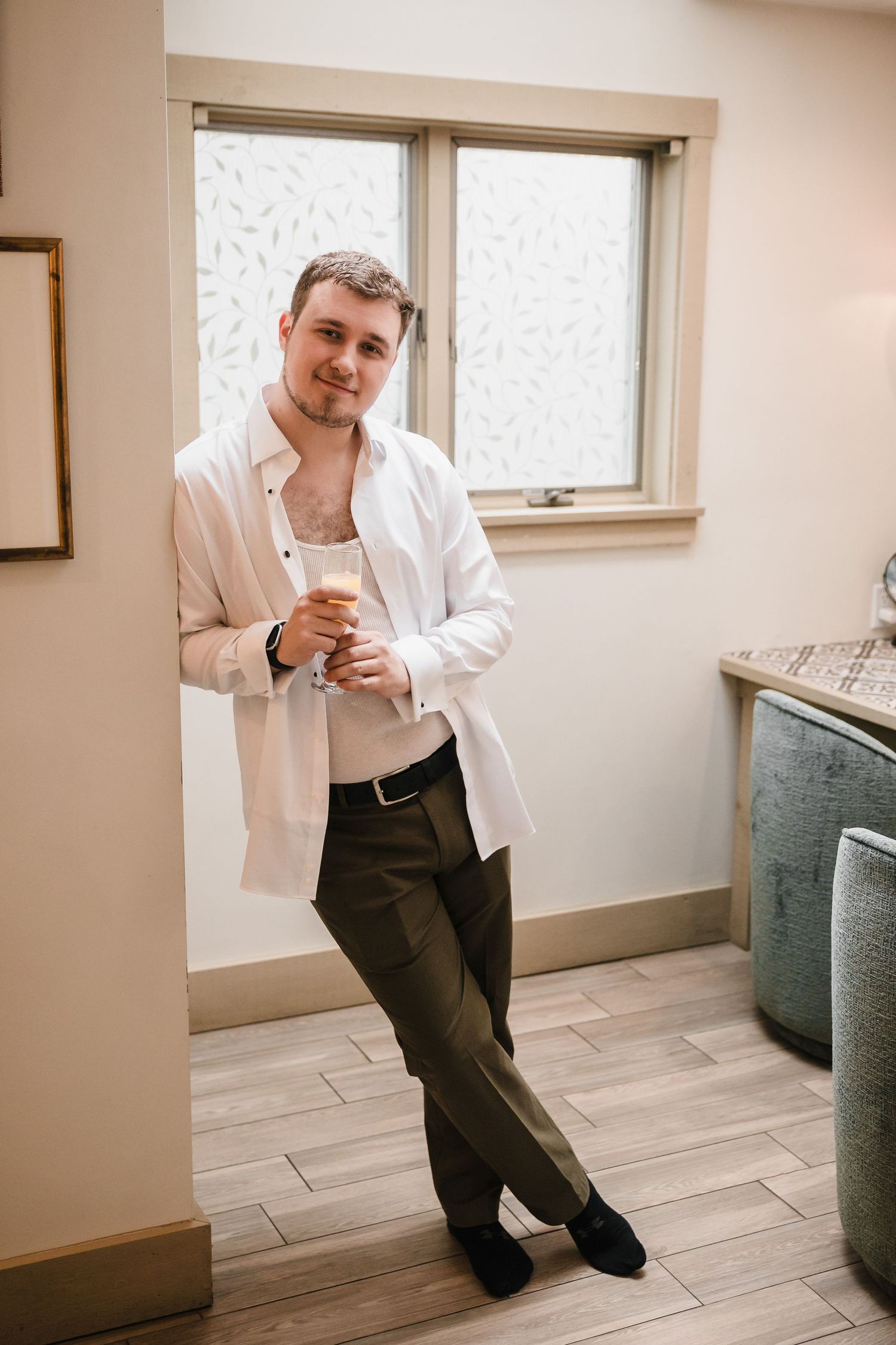 Groom getting ready portrait with champagne at Briar Barn Inn wedding in Massachusetts