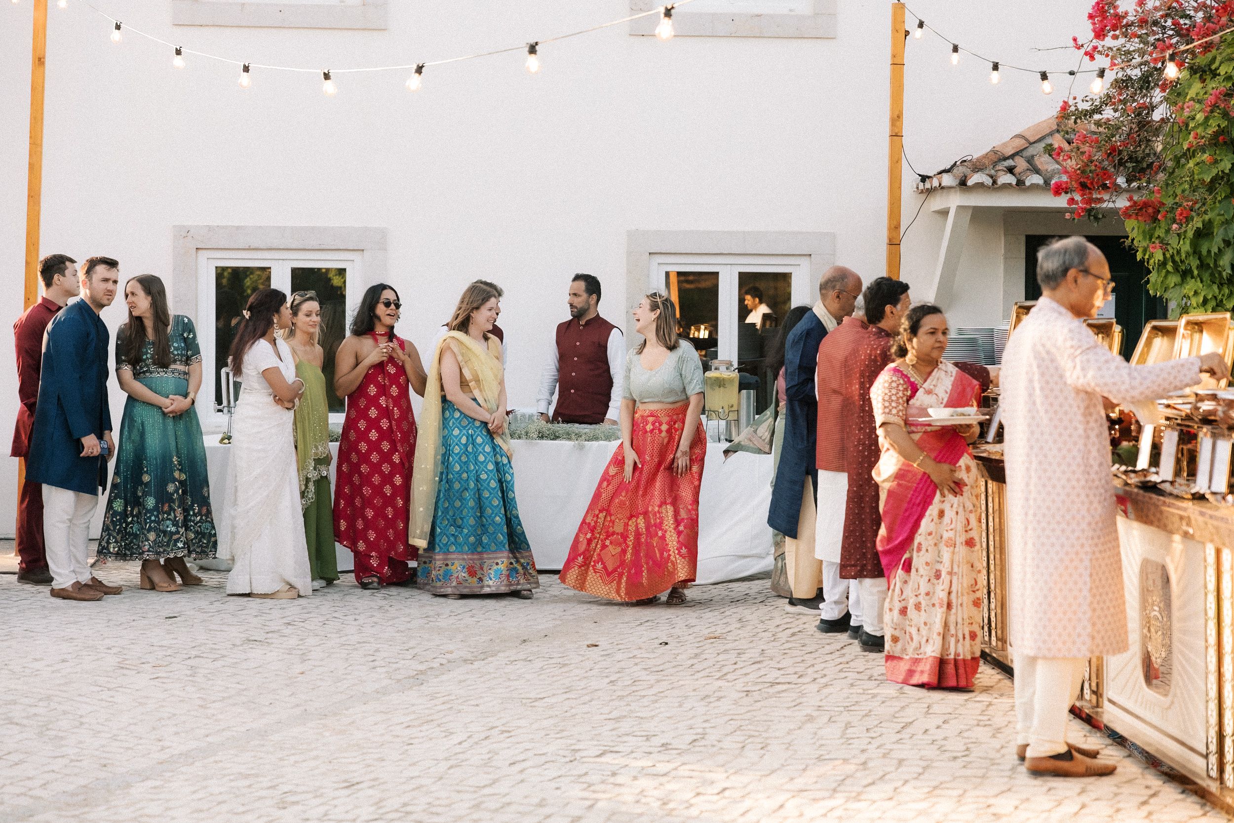 guests enjoying Gujarati food stations at destination wedding Portugal