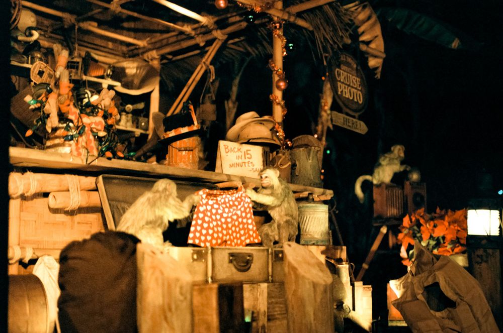 Vintage animatronic display showing rustic cabin scene with mechanical figures.