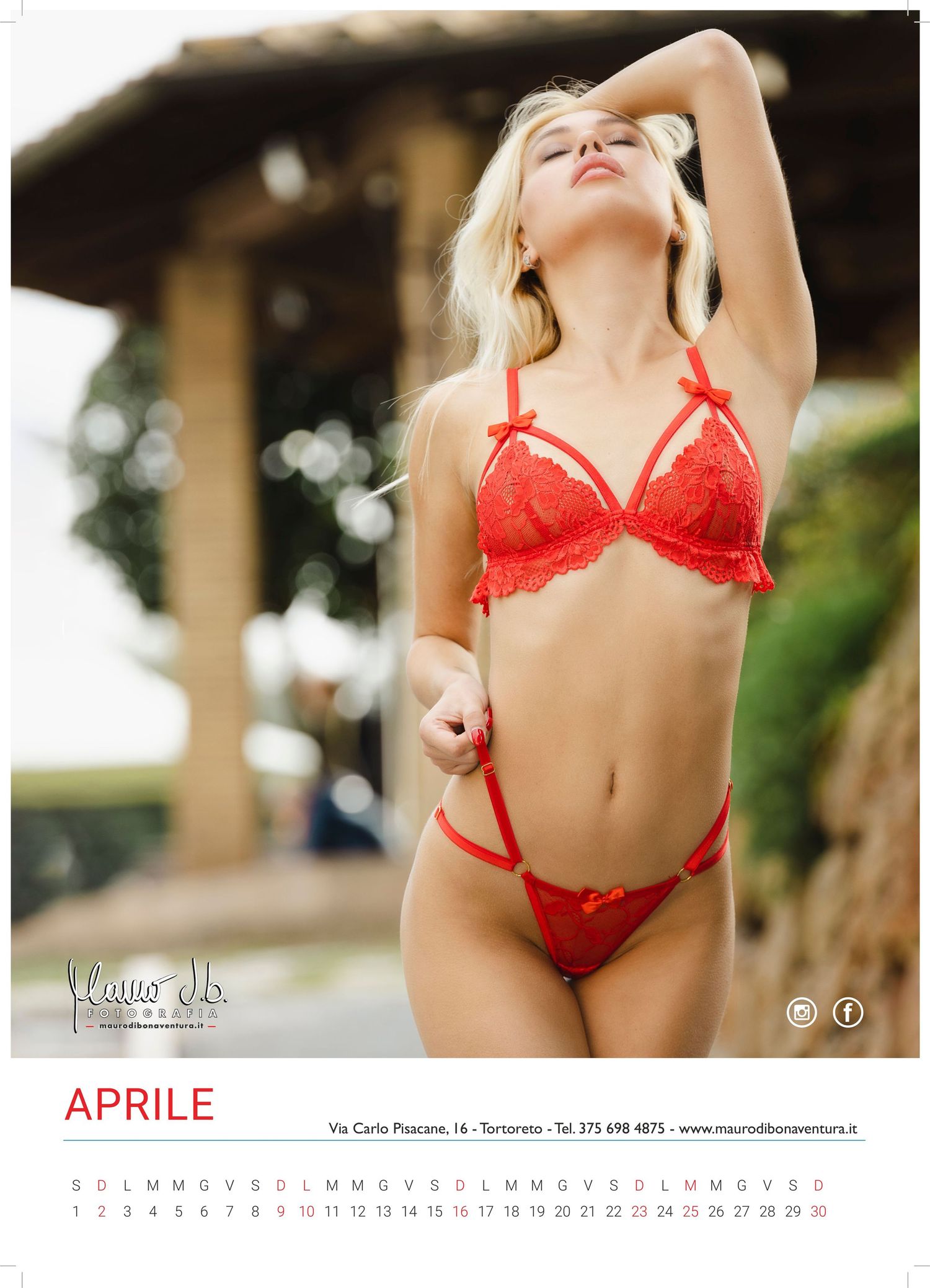 Calendar photo showcasing red lingerie in an outdoor setting.