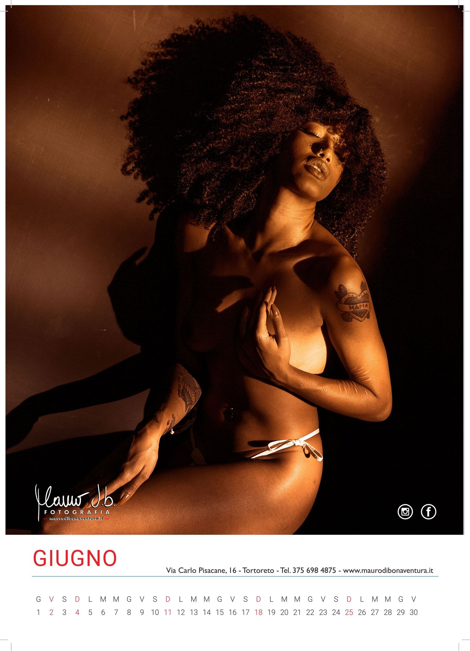 Artistic fashion portrait with warm lighting and natural hair styling.