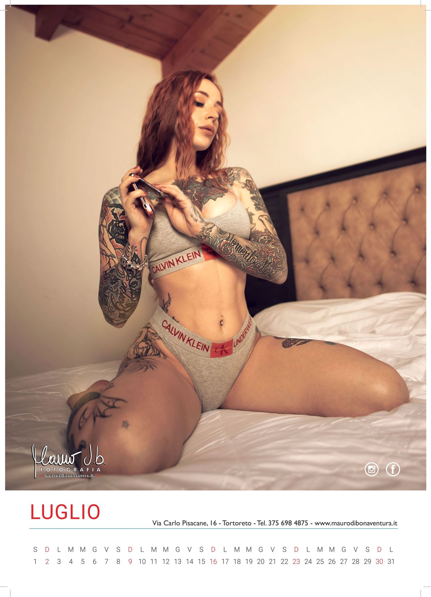 Calendar image featuring intimate fashion photography with tattoo art.