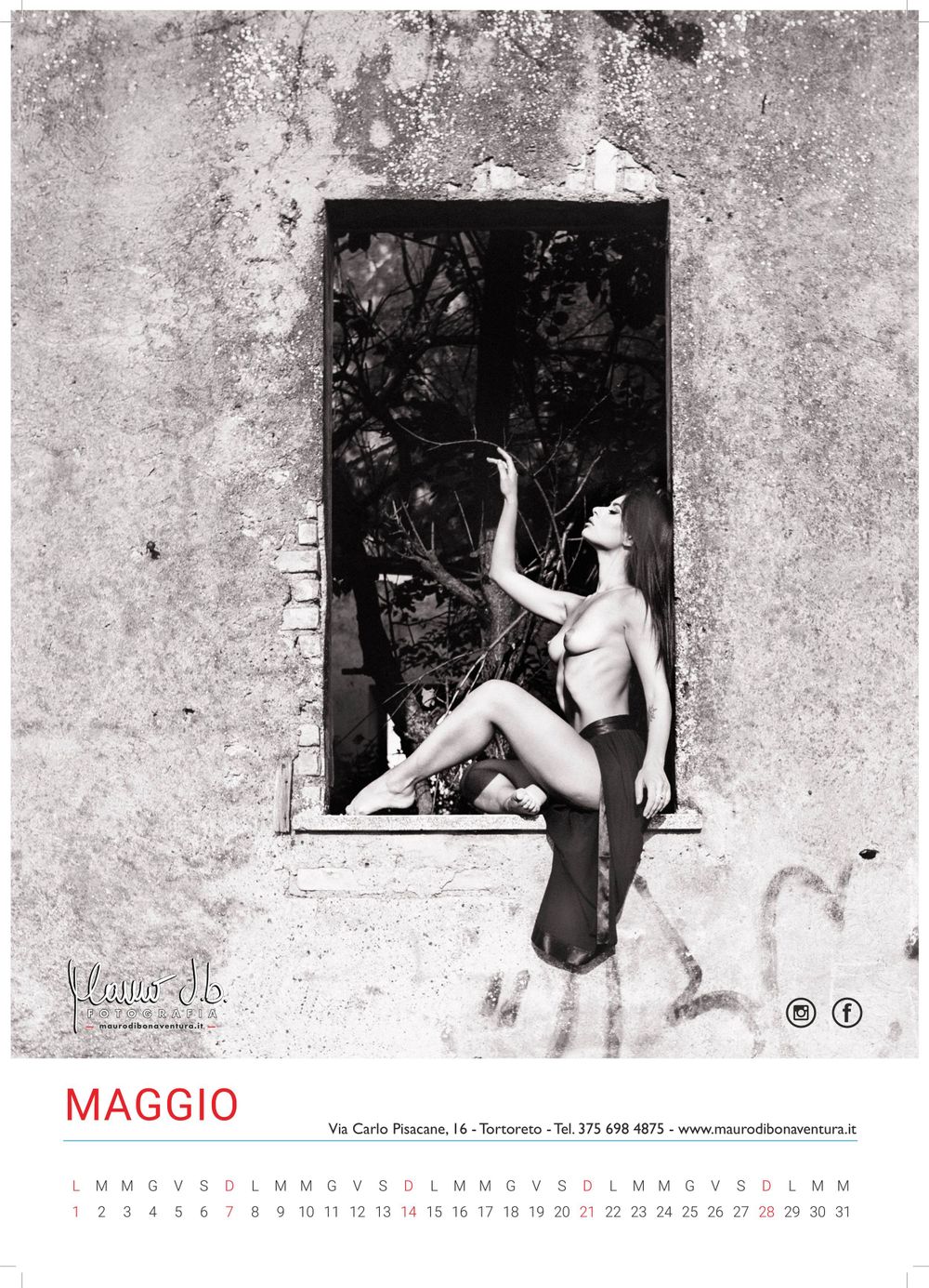 Black and white calendar art photo featuring a figure in a stone window frame.