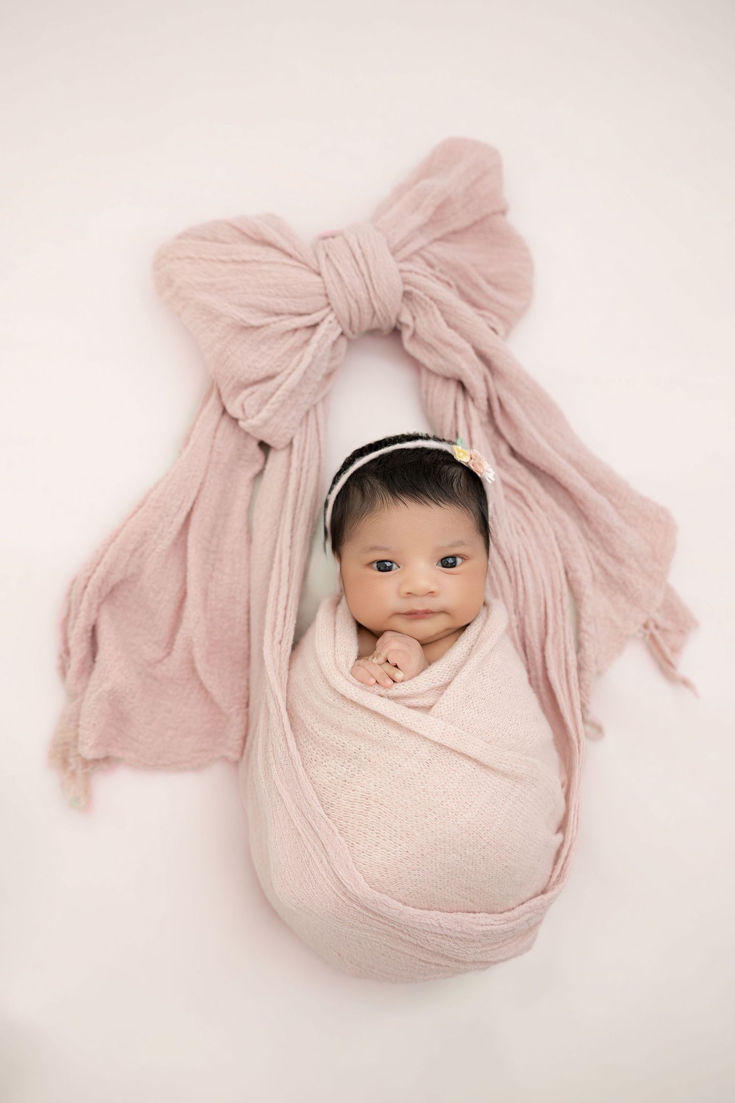 Sleeping newborn wrapped in cream swaddle – Maria Chao Photography newborn session