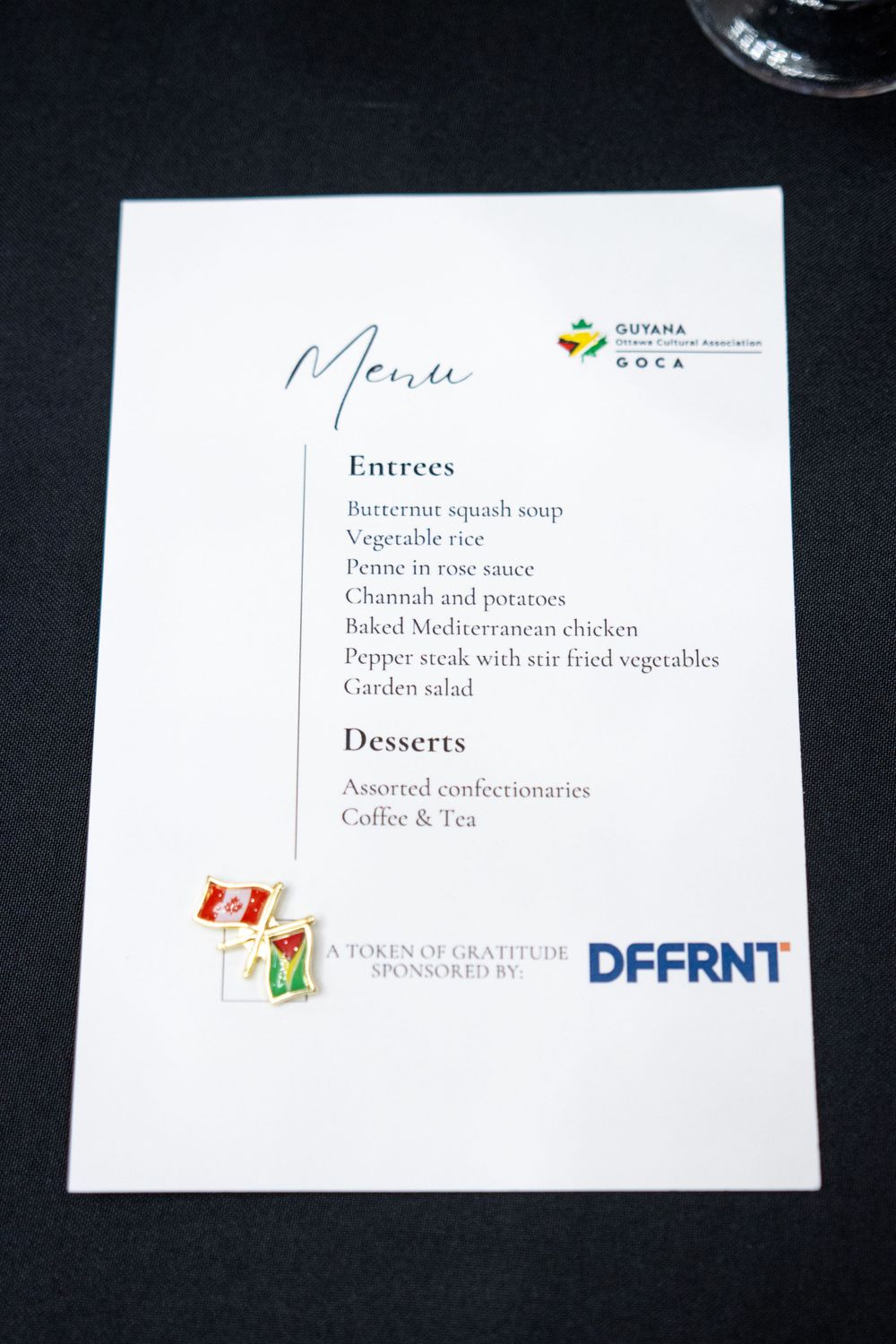 A restaurant menu on white paper showing entrees and desserts with multiple sponsors' logos at the bottom.